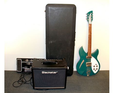 A cased Rickenbacker electric guitar together with a G7 effects console and HT5 amp.