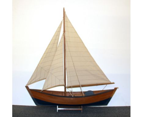 A wooden model sailing boat, L. 74cm H. 83cm.