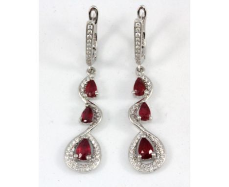 A matching pair of 925 silver ruby and white stone set drop earrings, L. 4.5cm.