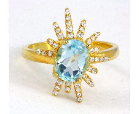 A 925 silver gilt blue topaz set ring, (R).