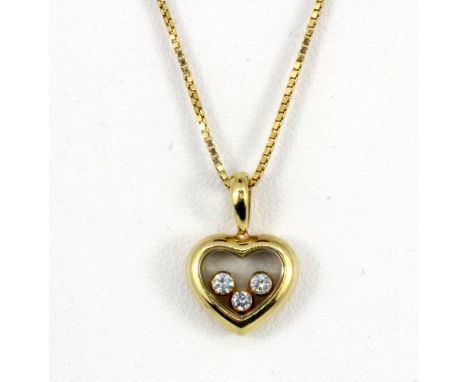 A Chopard 18ct yellow gold diamond set happy pendant and chain, in a Choppard box.