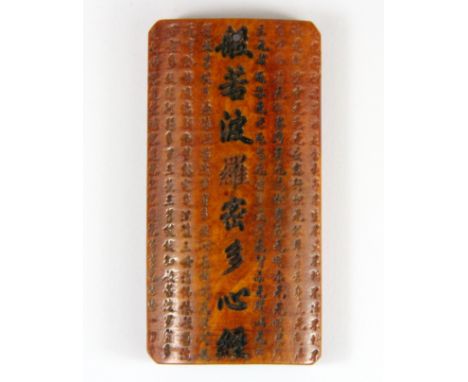A Sino-Tibetan carved Yak bone prayer amulet, h. 8.5cm.
