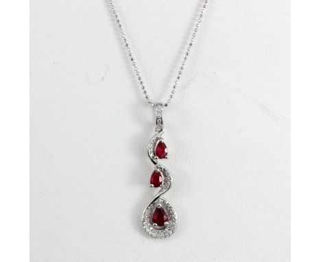 A 925 silver ruby and white stone set pendant and chain, L. 3.5cm.