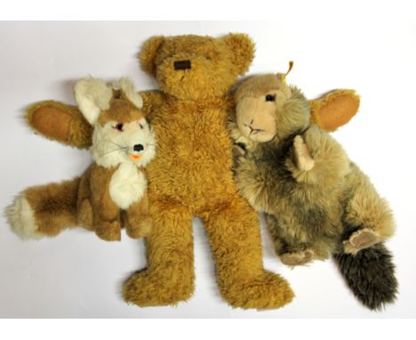 Two Steiff animal figures and a teddy bear.