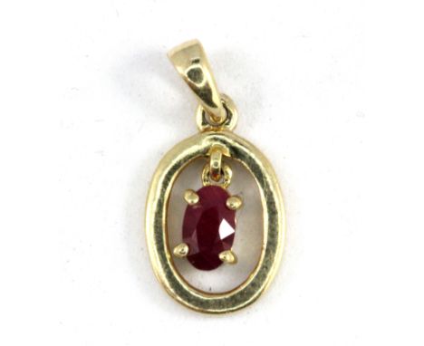A 9ct yellow gold ruby set pendant, L. 1.5cm.