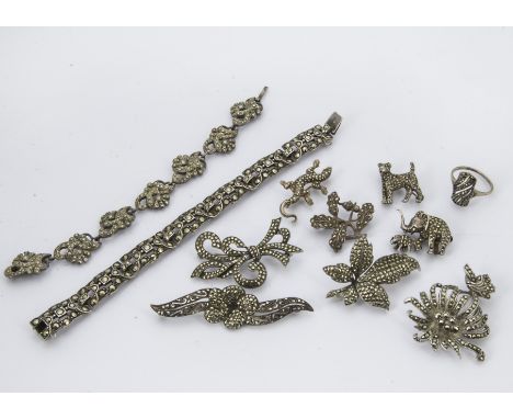 A group of eleven vintage silver and marcasite items of jewellery, including two bracelets, a ring, a lizard brooch, a terrie