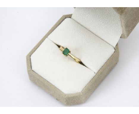 A certificated modern 18ct gold and emerald solitaire ring, rectangular stone stated in Colombian Emeralds International cert