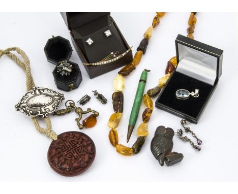 A collection of jewellery and other items, including an amber necklace, a modern silver pendant, three pairs of earrings, a C