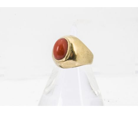 A Middle Eastern yellow metal and coral child's ring, marked 750, 4.5g and size H 