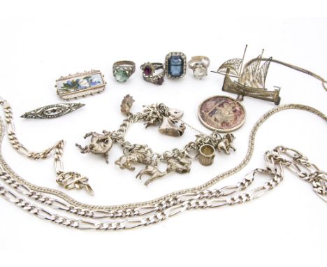 A collection of silver and white metal jewellery, including a pretty Edwardian silver and enamel panel of flowers brooch, a c