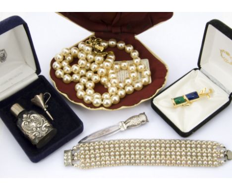 A collection of silver and costume jewellery, including a miniature kukri dagger brooch, a gatelink silver bracelet, and more