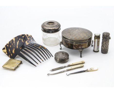 A collection of Victorian and later silver and other lady's dressing table items, including a circular trinket box on legs, a