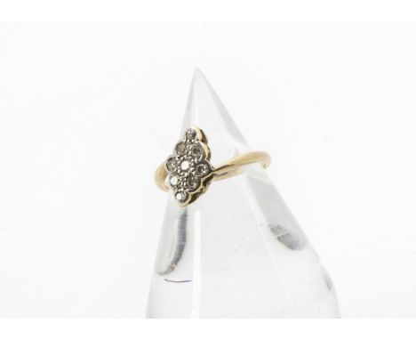 An Art Deco period diamond ring, the platinum tablet set with eight cuts on an 18ct gold band, 2.3g and size J 