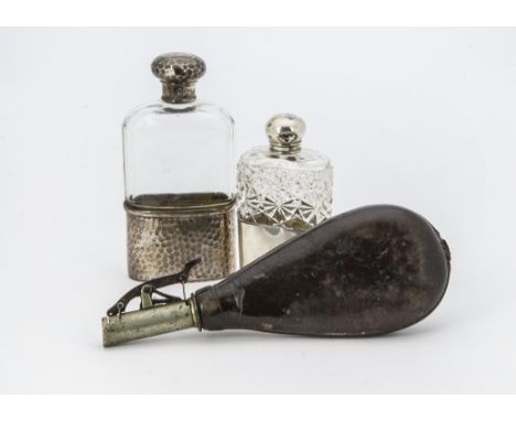 A late Victorian silver and hobnail cut glass hipflask, together with another later example and a shot flask (3) 