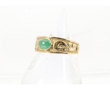 A 1970s Chinese gold and hardstone ring, having a cabochon jade style stone within tapering band, 5.2g and size P