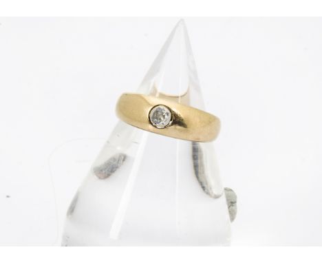 A Victorian 18ct gold and diamond ring, the tapered band having old cut in rubbed over setting, 3.8g and size L 