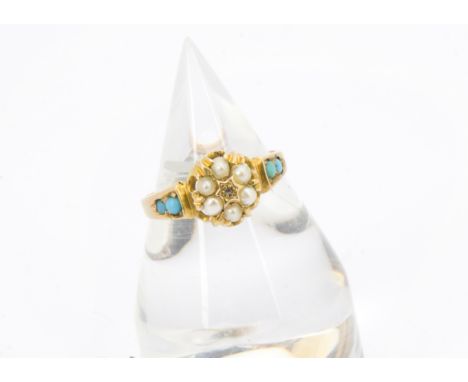 A Victorian 15ct gold posy ring, the flower head tablet set with seed pearls and a rose cut diamond and having two turquoise 