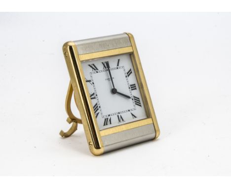 A modern Cartier travel alarm clock, ref. 7505, the "tank" style case having white dial with Roman numerals, quartz movementn