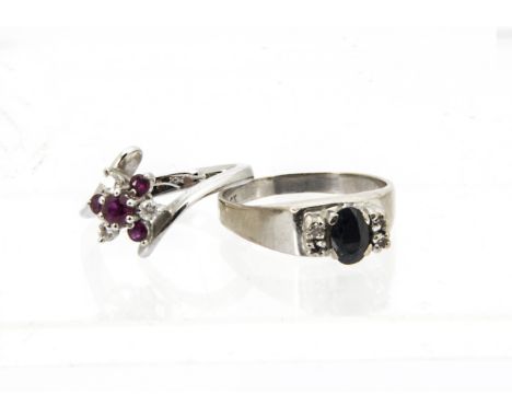 Two 18ct white gold and gem set rings, one with sapphire and four small diamonds, and one ruby and diamond cluster in crossov