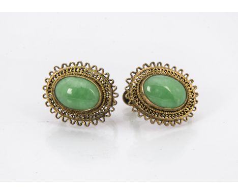 A pair of vintage Chinese earrings, having an oval jade panel within probably silver gilt filligree mounts, 2cm (2) 