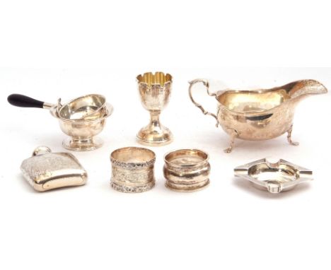 Mixed Lot: Edward VII silver sauce boat, Chester 1905, maker's marks for Stokes &amp; Ireland Ltd; a George V tea strainer an