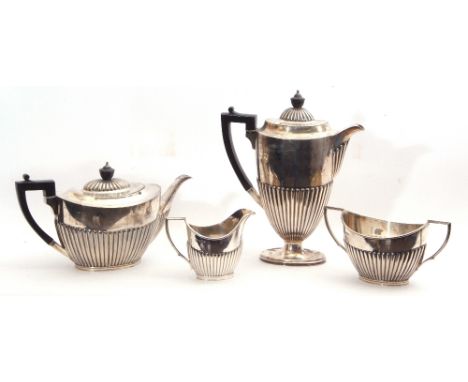 Late Victorian silver tea and coffee service comprising a coffee pot and tea pot, both with ebonised loop handles and a twin 