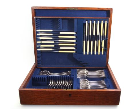 Part oak-cased canteen, matched with Old English pattern silver flatware, comprising eight table forks, eight dessert forks, 