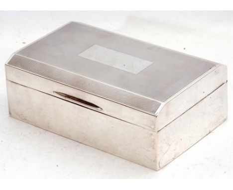 George VI silver table cigarette casket, engine turned decoration with a rectangular vacant cartouche, wood lined and loaded 