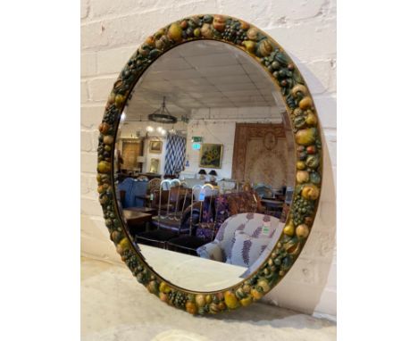 BARBOLA WALL MIRROR, early 20th century English, painted fruit oval frame with a bevelled plate, 72cm x 60cm. 