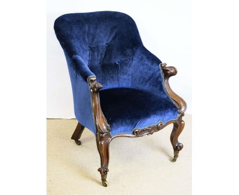 ARMCHAIR, 83cm H x 60cm, Victorian rosewood, circa 1860, in blue velvet with brass and ceramic castors. 