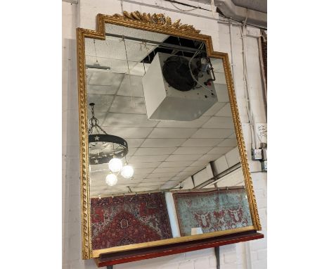 OVERMANTEL MIRROR, 110cm x 150cm H late 19th century French giltwood and gesso with a decorative surmount and shaped outline.