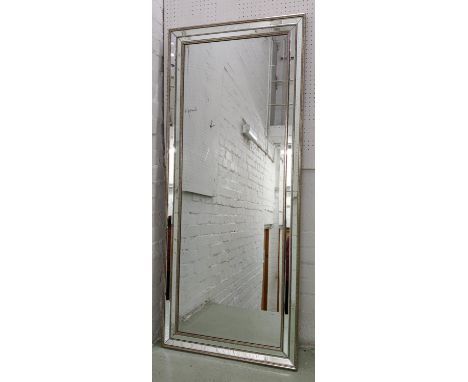 WALL MIRROR, 153.5cm x 64.5cm, contemporary bevelled plate, with mirrored frame and antiqued silvered accents. 