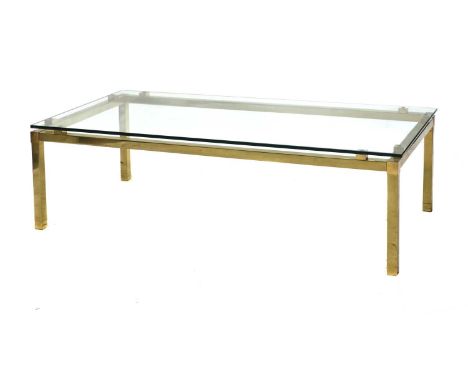 An Italian brass coffee table,1970s, of rectangular form, with a glass top, 130cm wide65cm deep40cm high, anda brass side tab