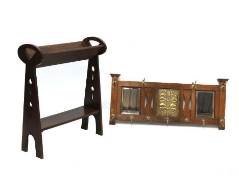 An Arts and Crafts oak book trough,with shaped and pierced ends, over a shelf, 61.5cm wide24cm deep76cm high, and an oak and 