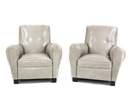 A pair of Art Deco-style grey leather armchairs,each with button backs, raised on ebonised block supports, 89cm wide100cm dee