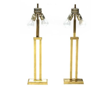 A pair of Italian brass table lamps,1970s, each with split pedestal arms, for two light sources each, 72cm high (2)