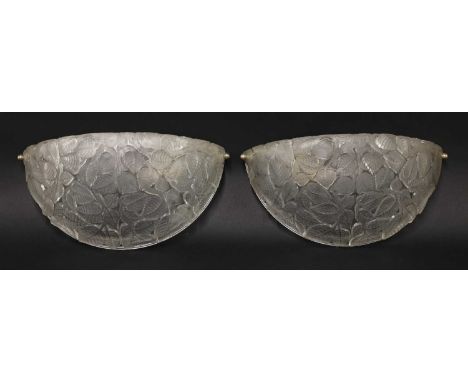 A pair of Lalique 'Charmes' glass wall lights,designed in 1924, moulded and frosted glass, each mounted with a single light f