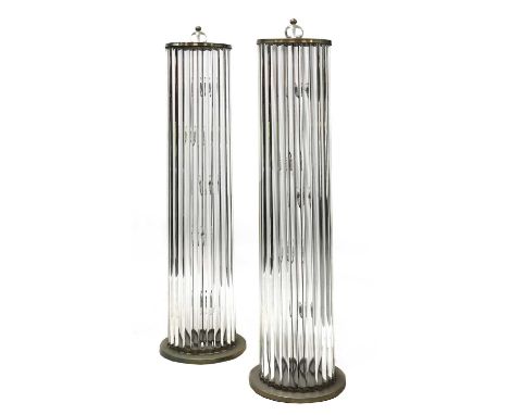 A pair of glass standard lamps,probably French, each with semicircular glass inserts enclosing light fitments within, mounted