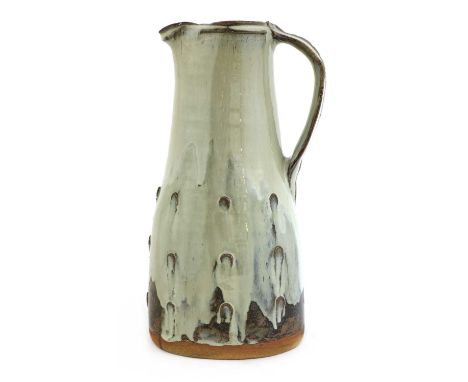 *Jim Malone (b.1946),a stoneware jug, with a trailing milk glaze, with thumb details, impressed artist's monogram and Ainstab