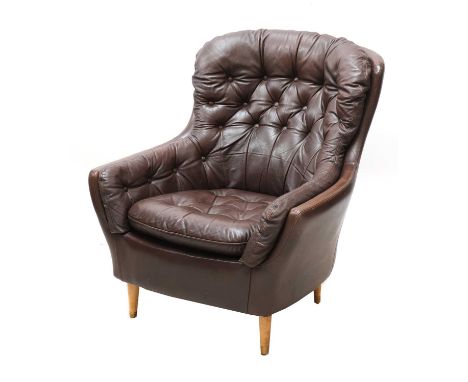 A Danish leather button back armchair,with turned legs with brass sabots, 82.5cm wide84cm deep90cm high, seat 44cm highCondit