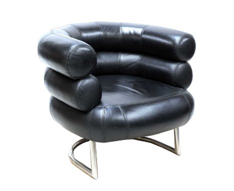 A 'Bibendum' black leather armchair,after a design by Eileen Gray, with a barrel bolster back, raised on a tubular cantilever