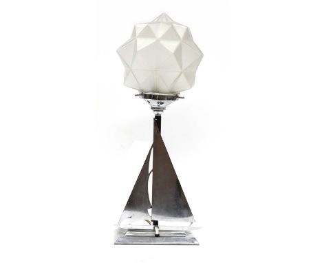 An Art Deco chrome table lamp,the base modelled with a yacht, with a multifaceted frosted globe shade,46.5cm highCondition re