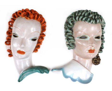 Two Goldscheider pierced eye pottery wall masks,No. 6427/3, modelled as a lady, with orange curling hair and lips, pierced ey