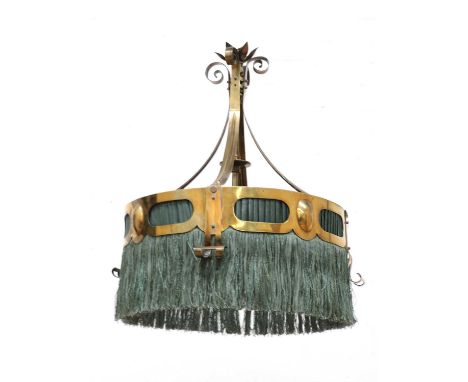 A secessionist brass pendant light,with a scrolled and pierced mount, with a green silk fringe,46cm diameter63cm high