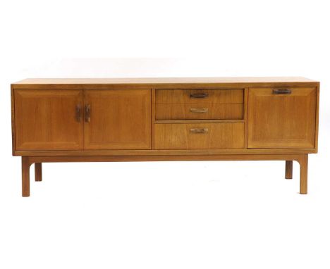 A 'Sierra' teak sideboard,1970s, G Plan, with a pair of doors opening on to one shelf, with three drawers, a forward-folding 