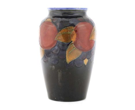 A William Moorcroft 'Pomegranate' urn,with a blue ground, impressed marks and blue monogram,16cm highCondition report: A few 