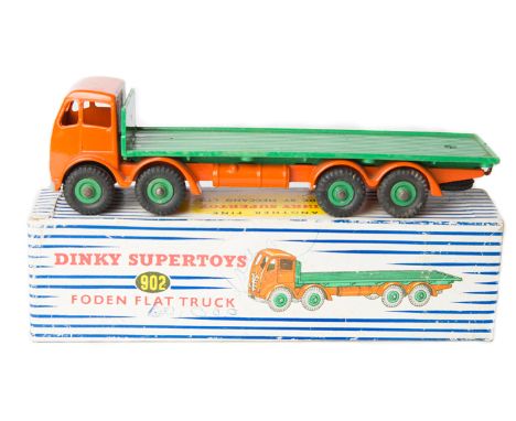 Dinky Supertoys Foden Flat Truck (902). Orange cab and chassis with mid green loadbed and wheels, with black rubber tyres. Bo