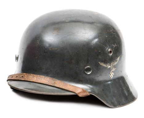 A Third Reich M35 Luftwaffe steel helmet,  with smooth grey finish, early type Luftwaffe eagle decal and hand painted tricolo