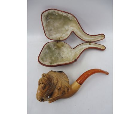 A good quality cased meerschaum pipe, the bowl ornately carved as a horse head.