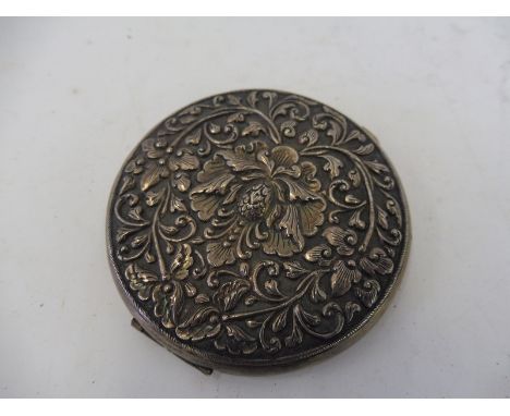 A Continental silver circular compact. 